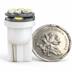 W5W T10 12V LED wedge bulb white housing and LED chips with coin for scale